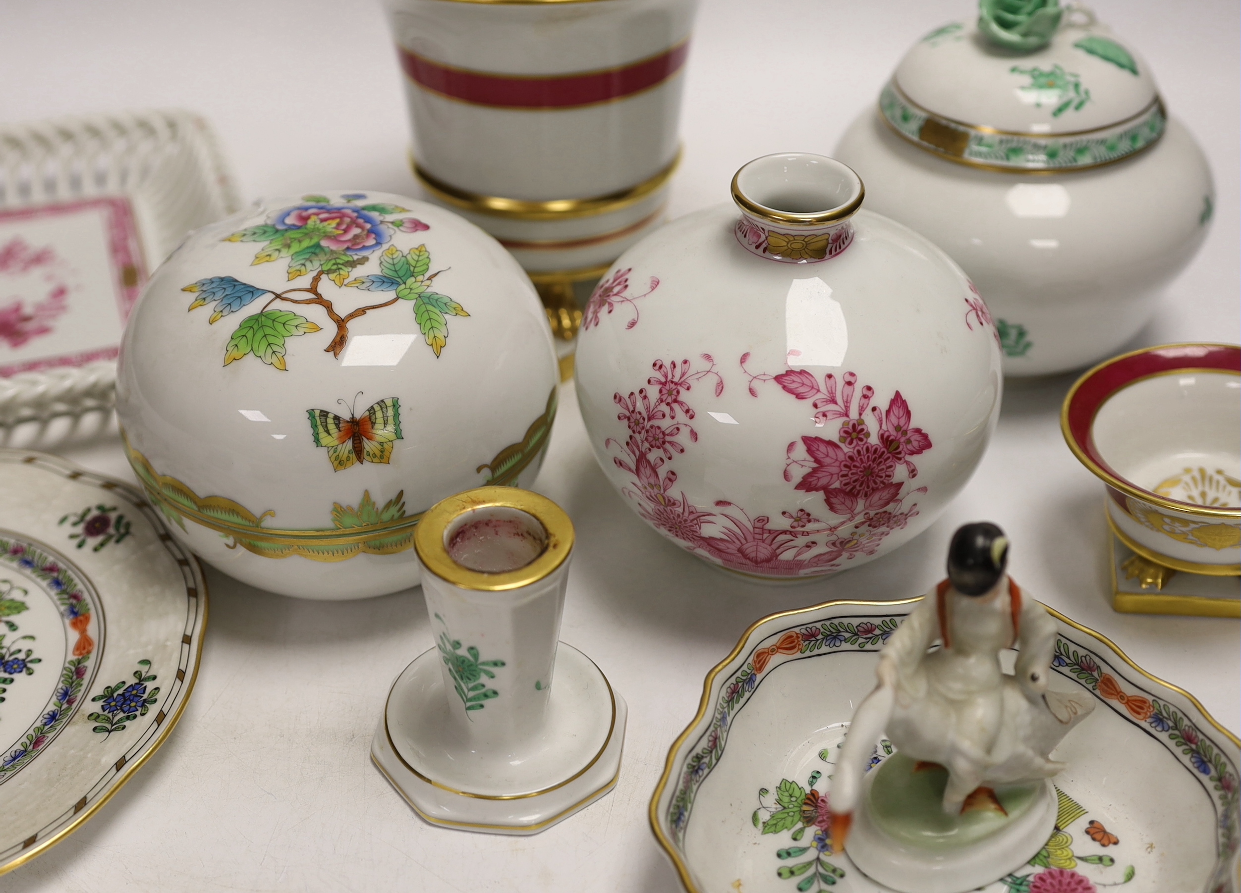 A group of Herend, Hungary porcelain wares including; a covered dish, tray, candlestick, two pedestal vases, boy on a goose, etc. tallest 13cm